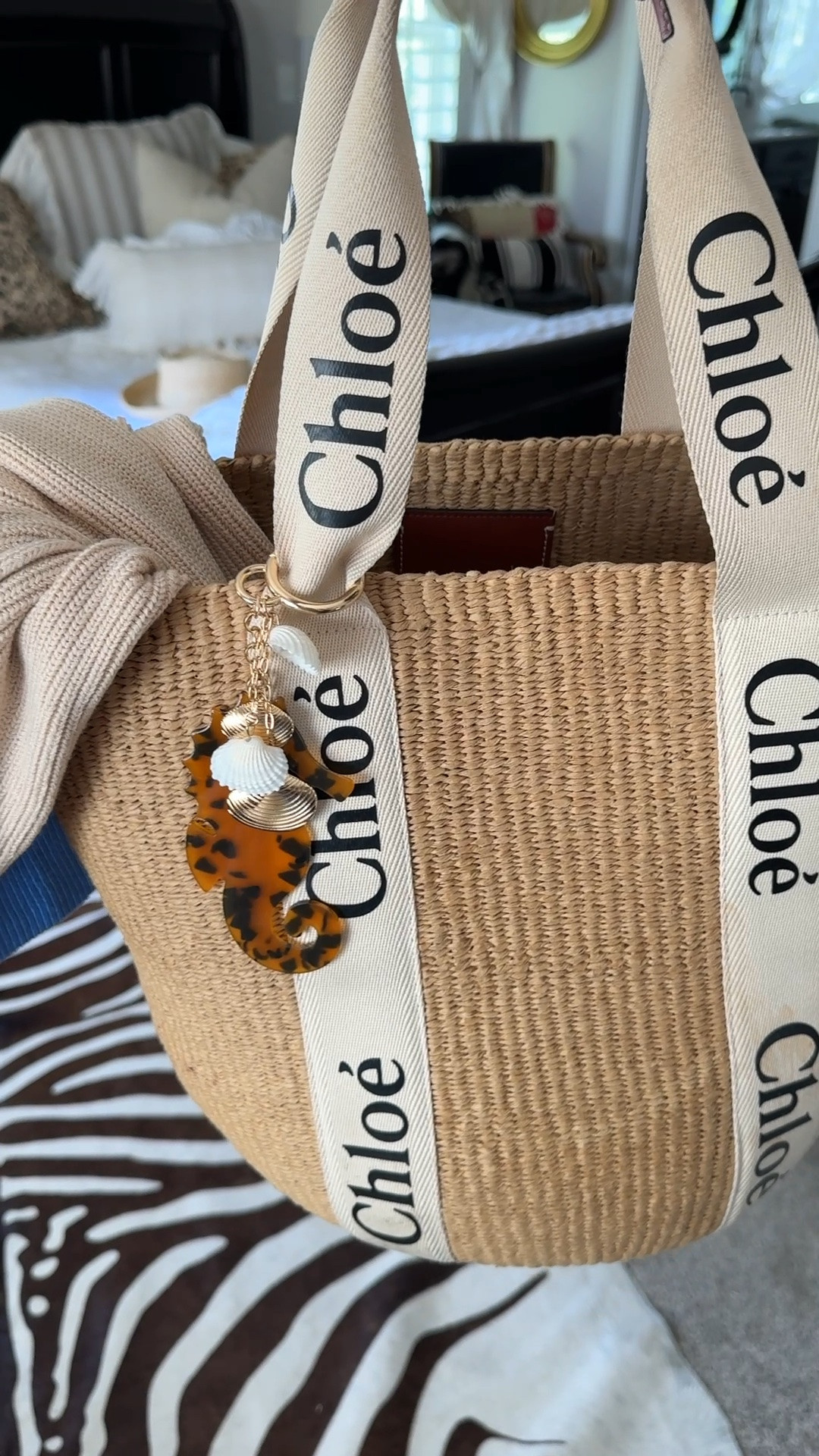 Bag charms are all the rage and this one looks so LUX 
And it’s $11 

Say WHAT!! Tortoiseshell seahorse and seashell  bag charm 

My Chloe bag has been one of my BEST purchases.. I’ve had for 4 summers and it never gets OLD
Large Star tote 

Sweater is my RL flag sweater

#LTKgrwm #LTKdayinmylife #LTKOver40