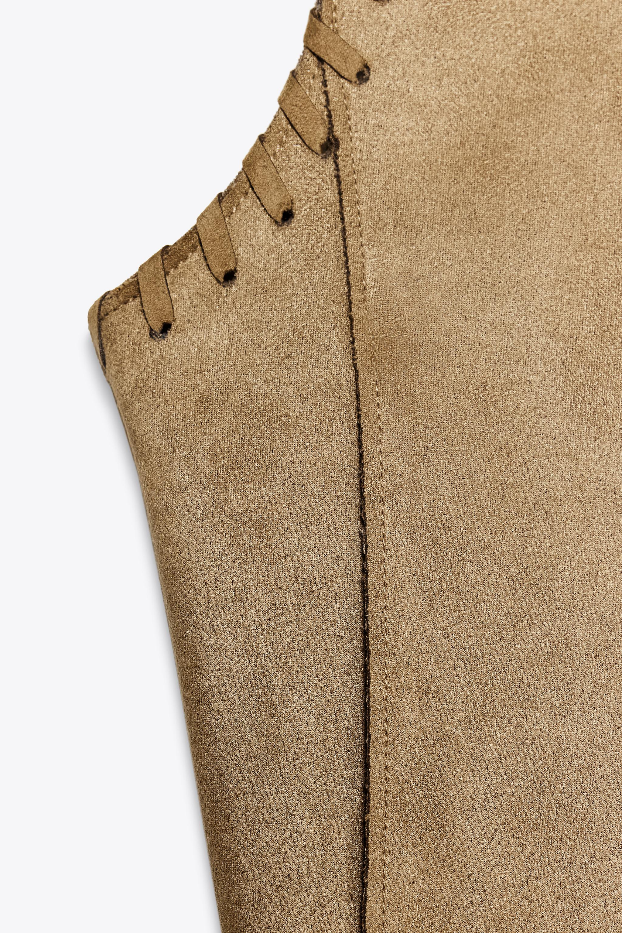 Open sleeveless waistcoat. Front pockets. Braided trim detail. | Zara UK