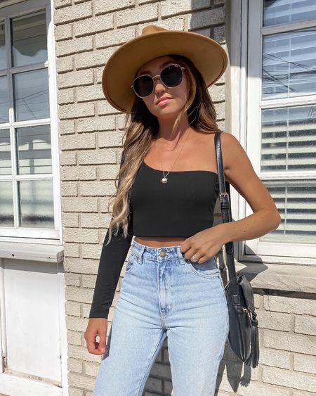 Spring outfit - long sleeve one shoulder top, high waist denim jeans, sunglasses, fedora hat

// #ltkfind #ltkunder50 #ltkunder100 #ltkseasonal #ltkstyletip #ltkseasonal #ltkfind crop top, long sleeve top, spring tops, summer tops, denim, jeans, basics, spring outfit, spring outfits, spring break, travel outfit, casual outfit, neutral style, Lack of Color, Abercrombie, Abercrombie & Fitch, A&F, Quay