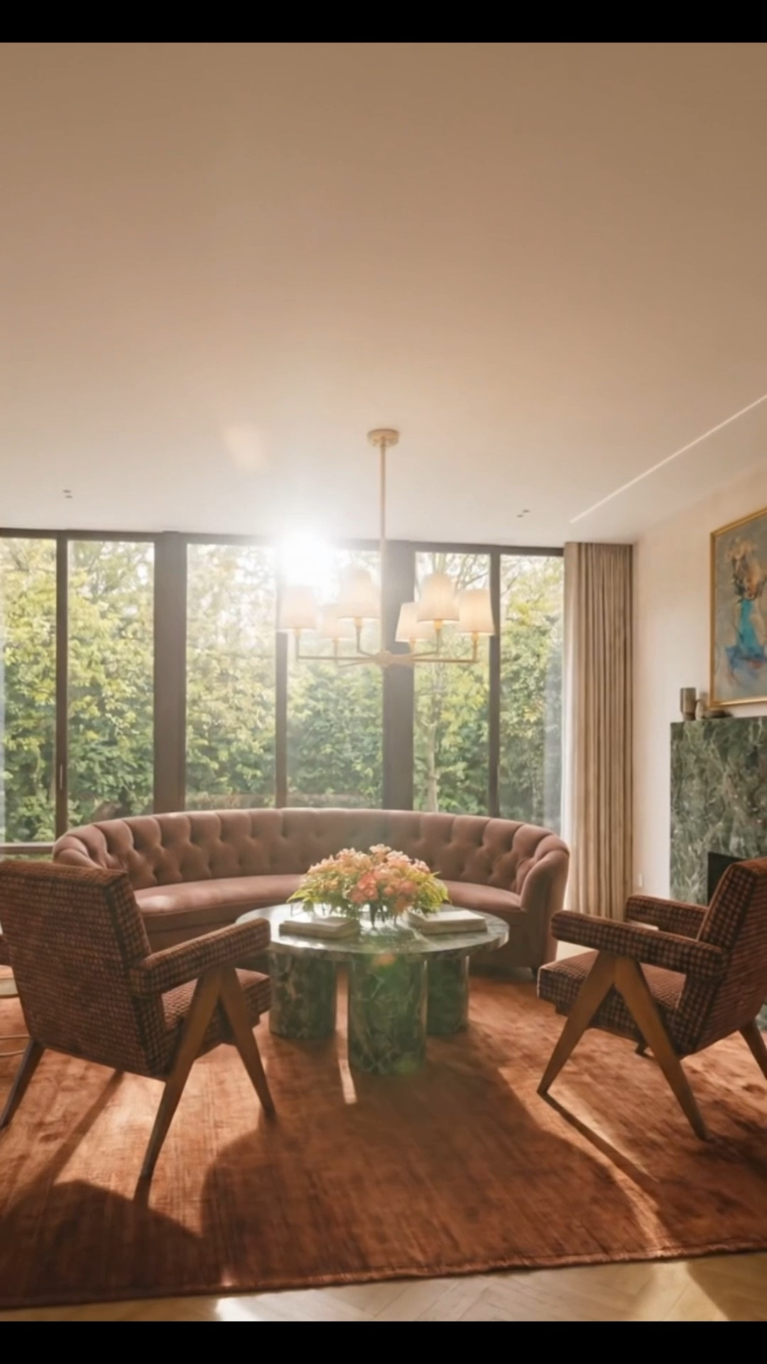Getting the living room ready for the fall and winter gathering season with richer color, texture, and a more collected, inviting feel. 🍂

The star of this space is the Arhaus Cortland Sofa in Quincy Burgundy, one of my favorites from the new Fall Collection. I love its streamlined curved silhouette—it feels classic and timeless, while the deep burgundy brings exactly the warmth and depth I want this time of year. Crafted by Arhaus upholstery artisans in North Carolina, it also has that substantial, beautifully made quality that makes a statement without feeling overly formal. 

I paired it with two Arhaus Elias Chairs. To me, the shape has a subtle mid-century modern influence, especially with the sculptural wood frame, while still feeling timeless enough to work with a more traditional sofa. I also love the rich patterned upholstery against the solid burgundy—it gives the room another layer without competing with the sofa. 

And the rug really completes the palette: the Lulu and Georgia Chiltern Handmade Rug by Jake Arnold in this rich rust tone. Its tonal variation and soft sheen add so much depth underfoot, while the earthy color ties together the burgundy, dark wood, marble, and brass throughout the room. Warm, elegant, relaxed, and ready for gathering season. 

#LivingRoom #LivingRoomDesign #FallHome #FallDecor #GatheringSeason #Arhaus #CortlandSofa #CurvedSofa #EliasChair #AccentChair #LuluAndGeorgia #JakeArnold #AreaRug #Rug #Chandelier #CoffeeTable #FlowerArrangement #Art #HomeDecor #LaborDaySale #LTKHome #LTKSaleAlert #LTKSeasonal

#LTKdayinmylife #LTKHome #LTKSaleAlert