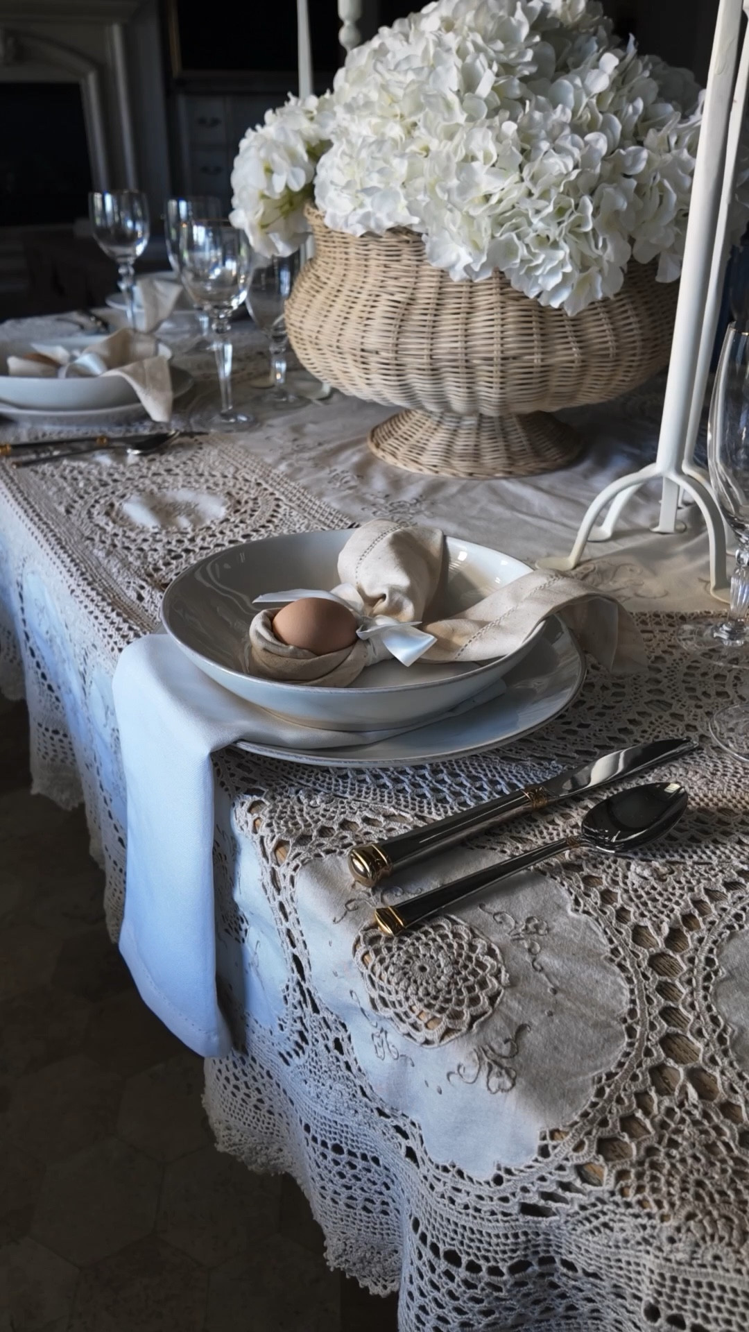 This table isn't a twenty dollar, twenty minute trend." — so it's consistent across platforms. But the LTK version pivots quickly from story to shoppable: "I linked everything I could below — similar linen napkins, cream plates, gold-accent flatware, faux hydrangeas, seagrass vessels, taper candles, candelabras, and Luminosity. If I own it and love it, it's here."