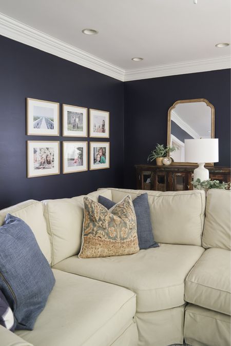 My living room has a wall of windows and a wall of white built-ins, so I painted the other two walls Hale Navy from Benjamin Moore. I love the navy-white contrast.

#LTKhome