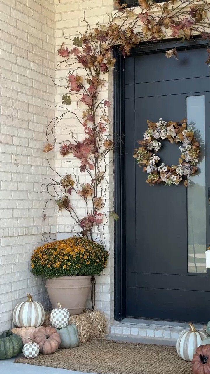 🍂✨ Fall has officially made it to our front porch! I mixed whimsical @officialmackenziechilds Mocha Check pumpkins + Café Floral wreath with real mums and heirloom pumpkins for that cozy, collected feel. The best part? The DIY arch above the door is a simple DIY made from gathered branches—it adds just the right amount of charm and character. 🏡🍁
Now every time we walk up, it feels like a warm autumn hug. 🤎

Use code ACCORDINGTOMANDY20 off your next order!!

#mcpartner #fallporch #falldecor #frontporch 

#LTKHome #LTKSeasonal #LTKStyleTip
