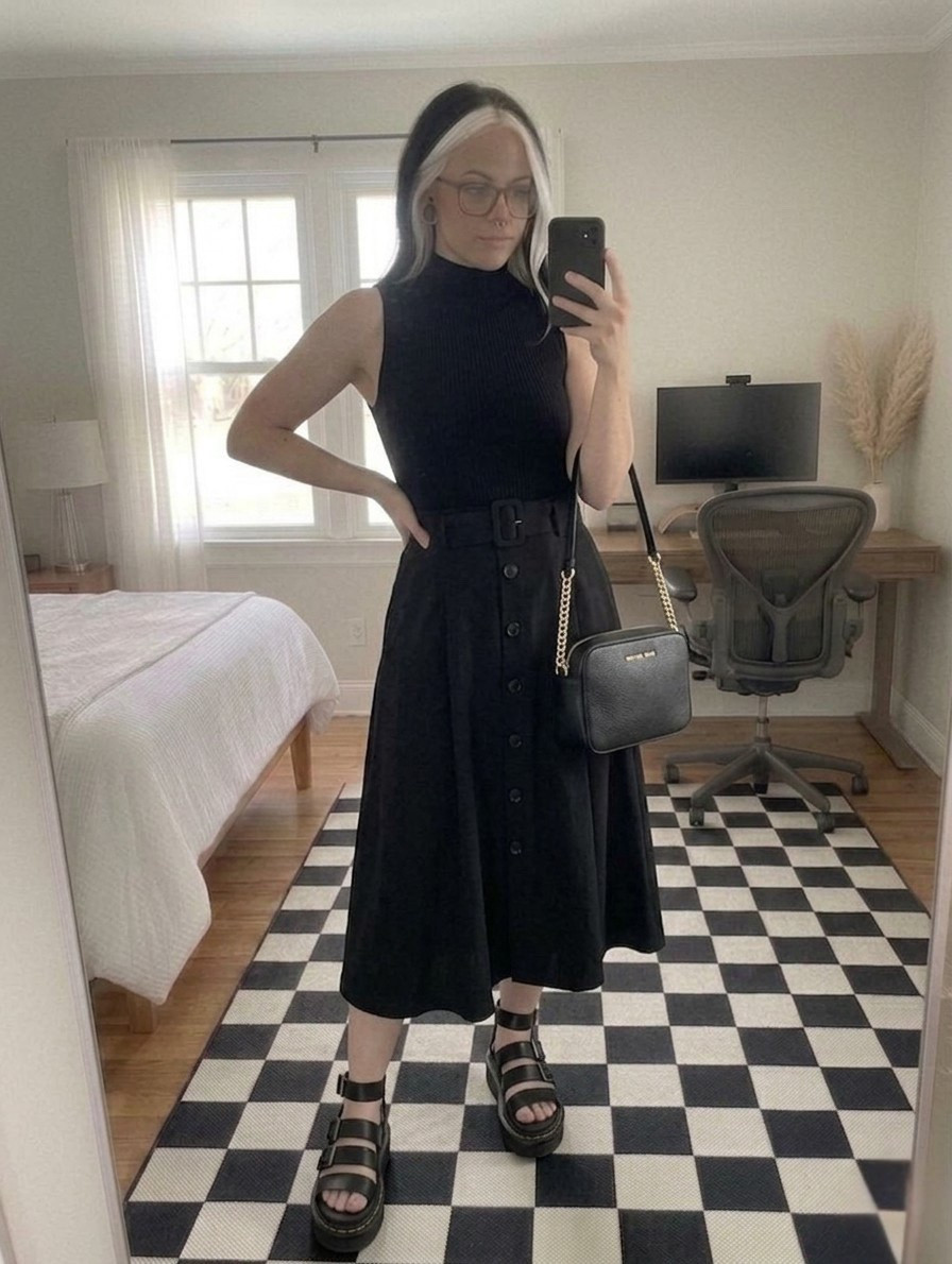 Nothing beats the effortless chic of a head to toe black ensemble. I am styling this mock neck sleeveless top with a belted button down midi skirt for a look that transitions perfectly from the office to dinner. Added some edge with chunky platform sandals and my favorite leather crossbody.

This skirt is a wardrobe staple because the fit is so flattering! Shop all the details below.

#LTKootd #LTKSeasonal #LTKMidsize