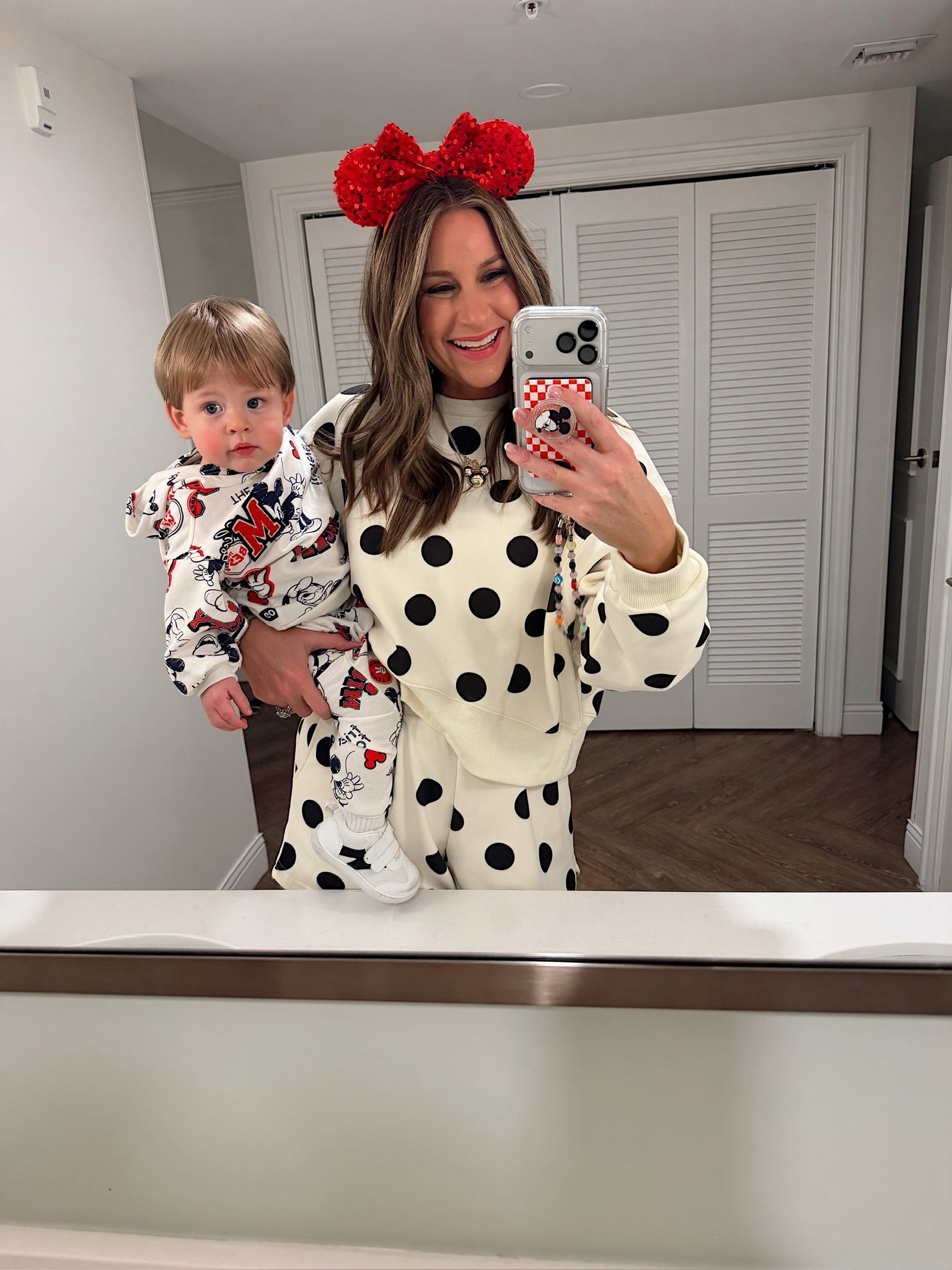 Mommy and mini Disney outfits of the night! Storms outfit is Amazon and I’m in a medium polka dot sweatshirt and shorts, medium jacket with iron on patch, sequin Minnie Mouse ears and accessories - what to wear at Walt Disney World at Christmas! 

#LTKBaby #LTKHoliday #LTKTravel