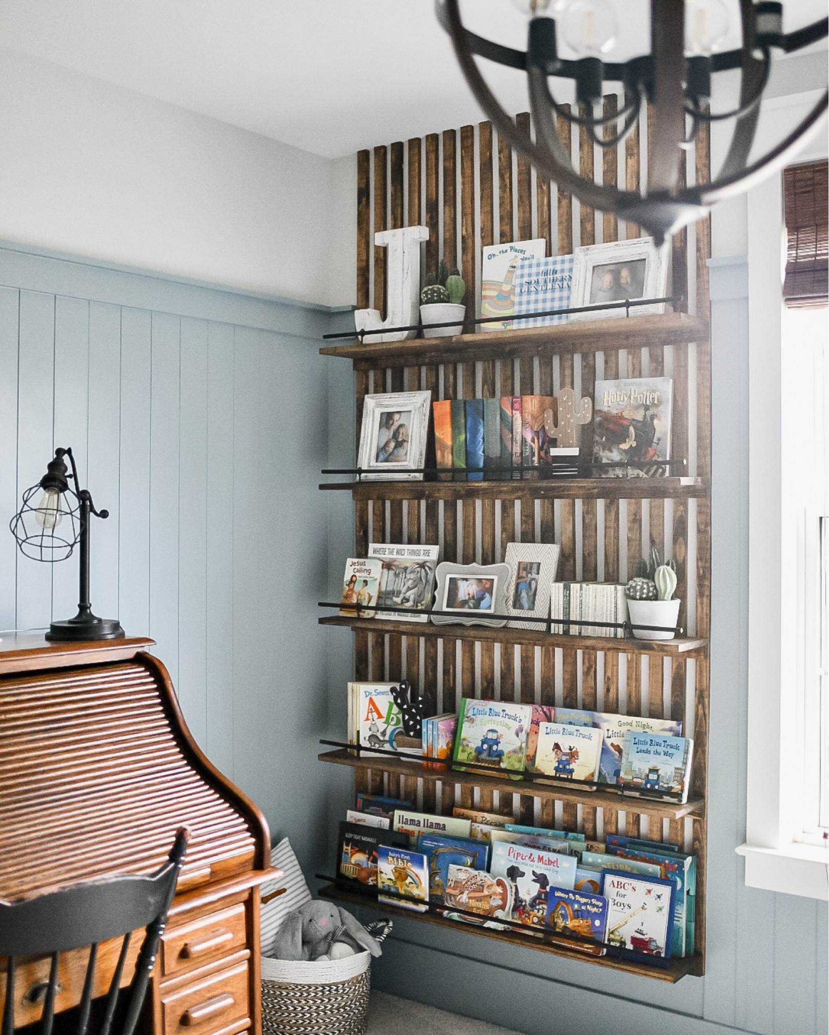 Boys room DIY slat wall bookshelves bookshelf kids room playroom reading book corner storage and organization light fixture window treatment shades bamboo blinds 

#LTKkids #LTKfamily #LTKhome