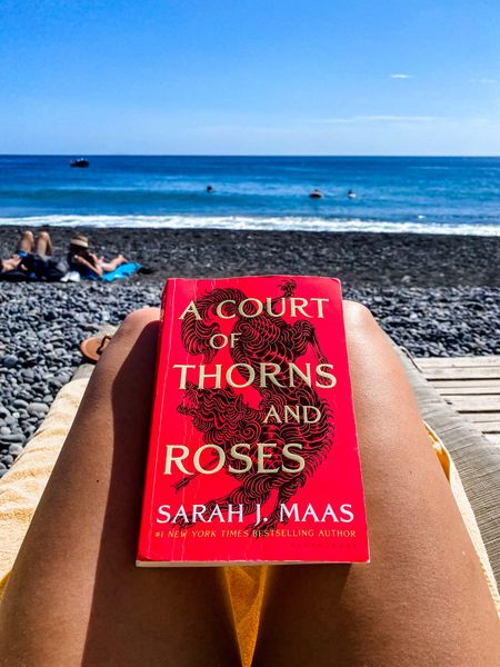 BOOK REVIEW: A Court of Thorns and Roses by Sarah J. Maas 🤓📚

I did NOT think I was going to like this book. Fantasy Fiction is so not my thing… BUT this book, this story is CAPTIVATING. I literally could not put it down. I almost took PTO so I could stay home from work and read it all day 🤪

To me, this story was a combination of Beauty and The Beast, The Hunger Games, and Game of Thrones. In all the best ways. The story is beautifully written and Sarah J. Maas is an amazing author. My mind was watching a really intense movie the whole time I was reading this and i was on the edge of my seat the entire time. Do yourself a favor and read this book, especially for the ✨spicy✨ romantic scenes 💃🏻❤️‍🔥💥🎇⚡️

In order to feed her starving family, Feyre kills a wolf while hunting in the woods and her life is never the same again. An immortal beast comes to claim her as retribution for breaking The Treaty between her human kind and the lethal, immortal faeries. Feyre is whisked away to the magical lands of Prythian to spend the rest of her days. And what comes in her time spent in Prythian is nothing you could ever imagine!!

⭐️⭐️⭐️⭐️⭐️ Buy this book now and read it! Buy the whole series and spend Fall/Winter reading the entire thing! You will NOT regret it! BRB starting the second book in this series now ✌🏼

ACOTAR, novel, book, TBR, what to read, good reads, good books, currently reading, LTKbooks LTKreads, fantasy fiction, young adult, ltkfall ltkwinter, reading list, book list, series

#LTKtravel #LTKHalloween #LTKU