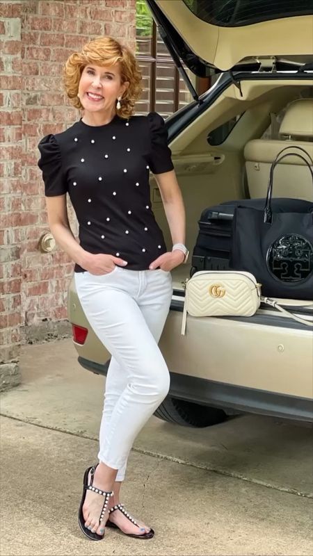 This black & white is pearl embellished. My black jelly sandals are pearl embellished! My Apple Watch band is made from (faux) pearls, and my earrings are pearl drop earrings! 

My affordable pearl embellished knit top has scattered pearls all over the front and they set off my white jeans perfectly! 

#LTKstyletip #LTKSeasonal #LTKshoecrush