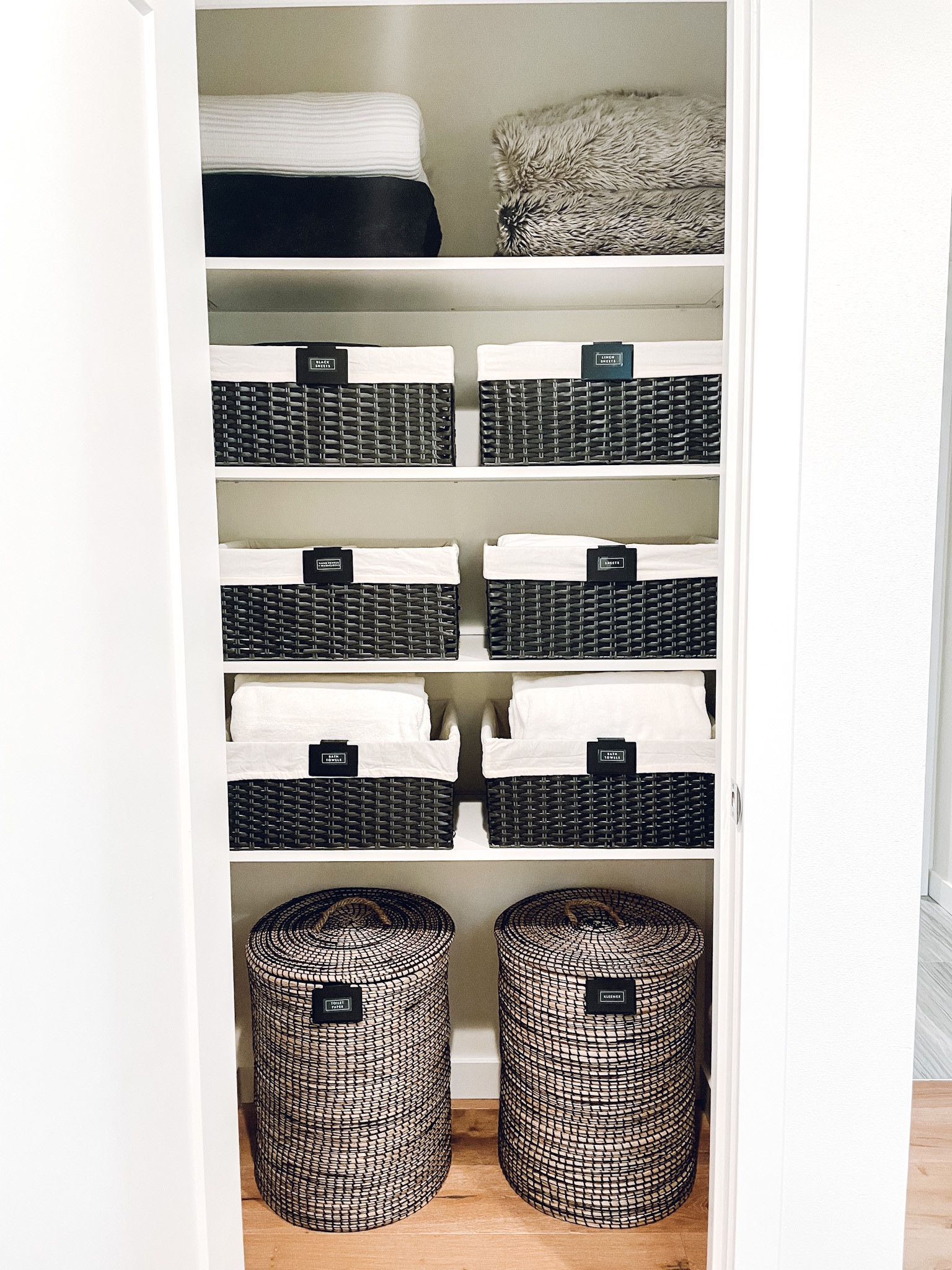 Linen closet organization. The Container Store bin clip, Montauk bin, and Round Striped Seagrass Hamper✨

#LTKhome #LTKfamily