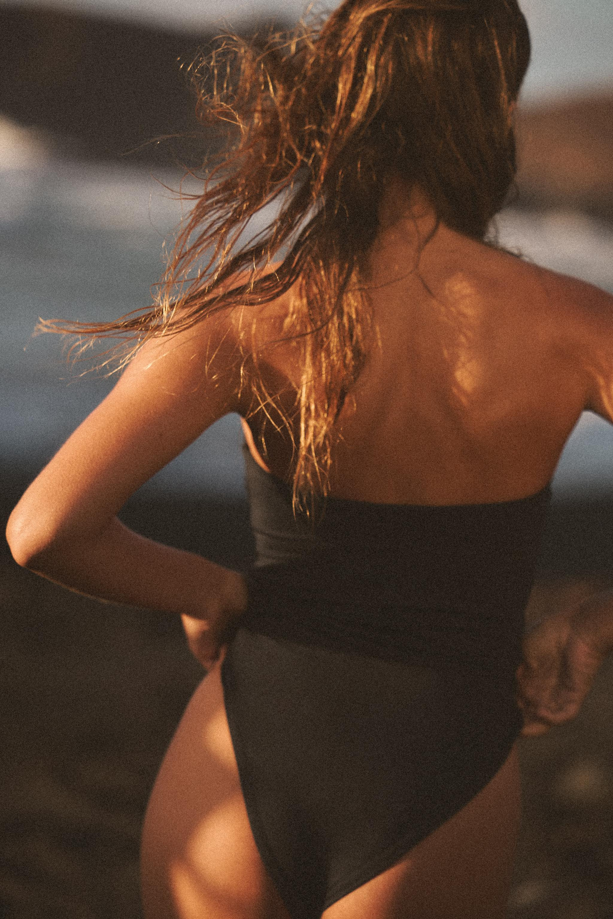 Bandeau swimsuit with a straight neckline and off-the-shoulder design. Removable cups. Detail of ... | Zara US