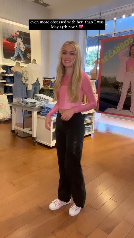 Back to School in Prep Style with this Barbie pink sheet top, overlaying a white corset and black cargo pants. 💖🖤🤍 American Eagle 🦅 has the cutest fall style! And peek these pink the white floral high top sneaks too!💗

#LTKunder50 #LTKunder100 #LTKBacktoSchool
