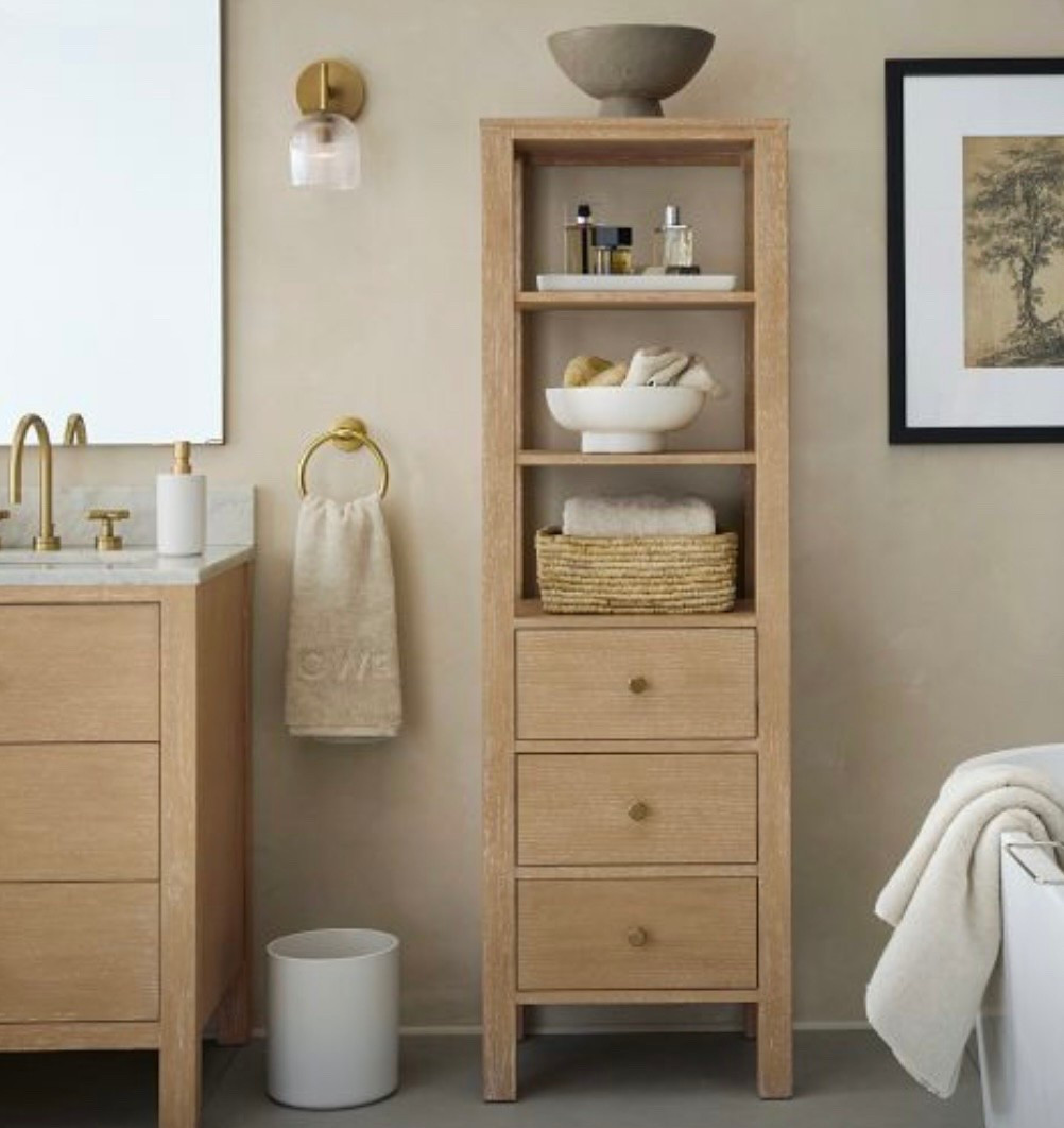 Additional bathroom storage in a beautiful light wood shelf with drawers. 

#LTKHome
