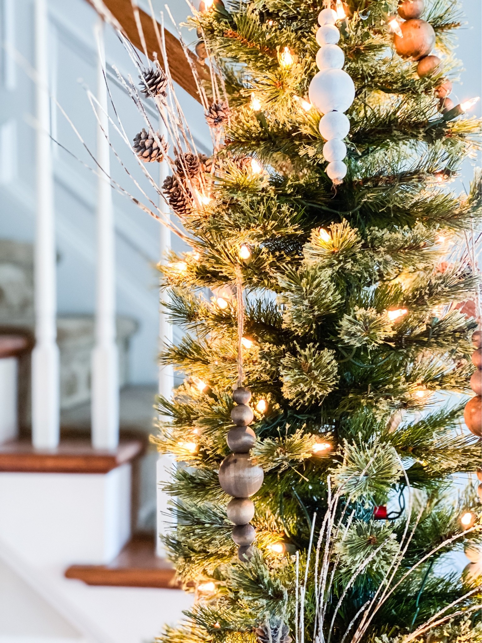 Decorate your Christmas tree with these pretty DIY wood bead ornaments. A budget friendly way to decorate any size tree to create a festive holiday home. Stain or paint the beads to coordinate with your Christmas aesthetic. #Christmastreeornament #Christmascrafts #Christmasdecorating

#LTKSeasonal #LTKHoliday #LTKhome