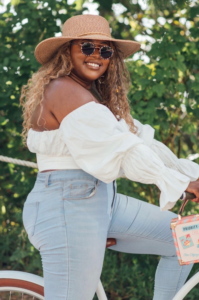 Biking through paradise in style! This dreamy summer look pairs a wide-brim straw hat and bold sunnies with a puff-sleeve crop top and high-rise denim—aka the perfect outfit for a beachside cruise or farmers market stroll. That playful travel-themed handbag? Just the cherry on top. Tap in for outfit details and warm-weather vibes.

#LTKSummerEdit #LTKStyleTip #LTKTravel
