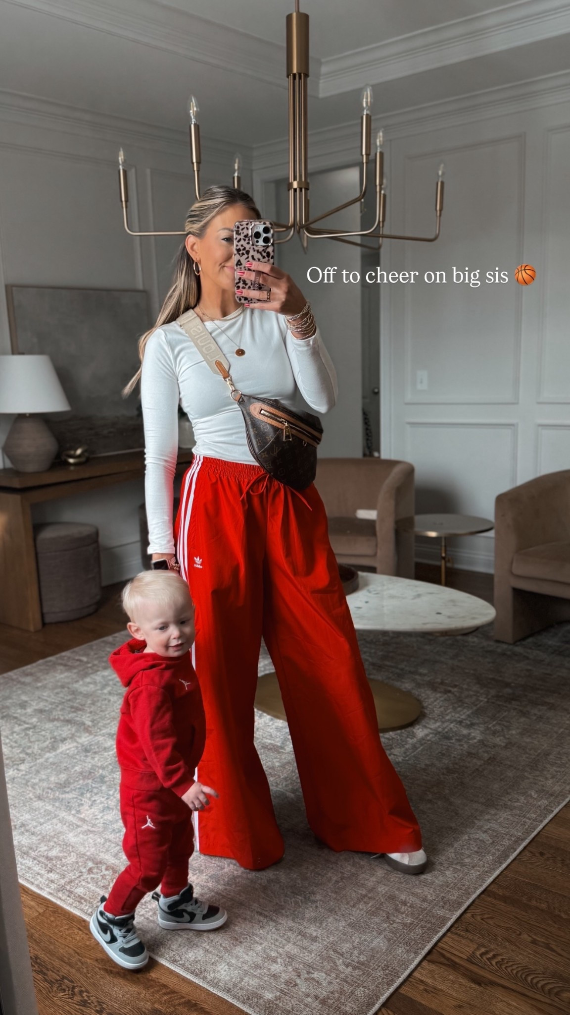 Off to cheer on big sis 🏀 Saturday sport’s mom outfit of the day! My pants are so fun! Definitely oversized I have a small regular. Reid’s little toddler Nike set is the cutest! 

#LTKKids #LTKdayinmylife #LTKootd
