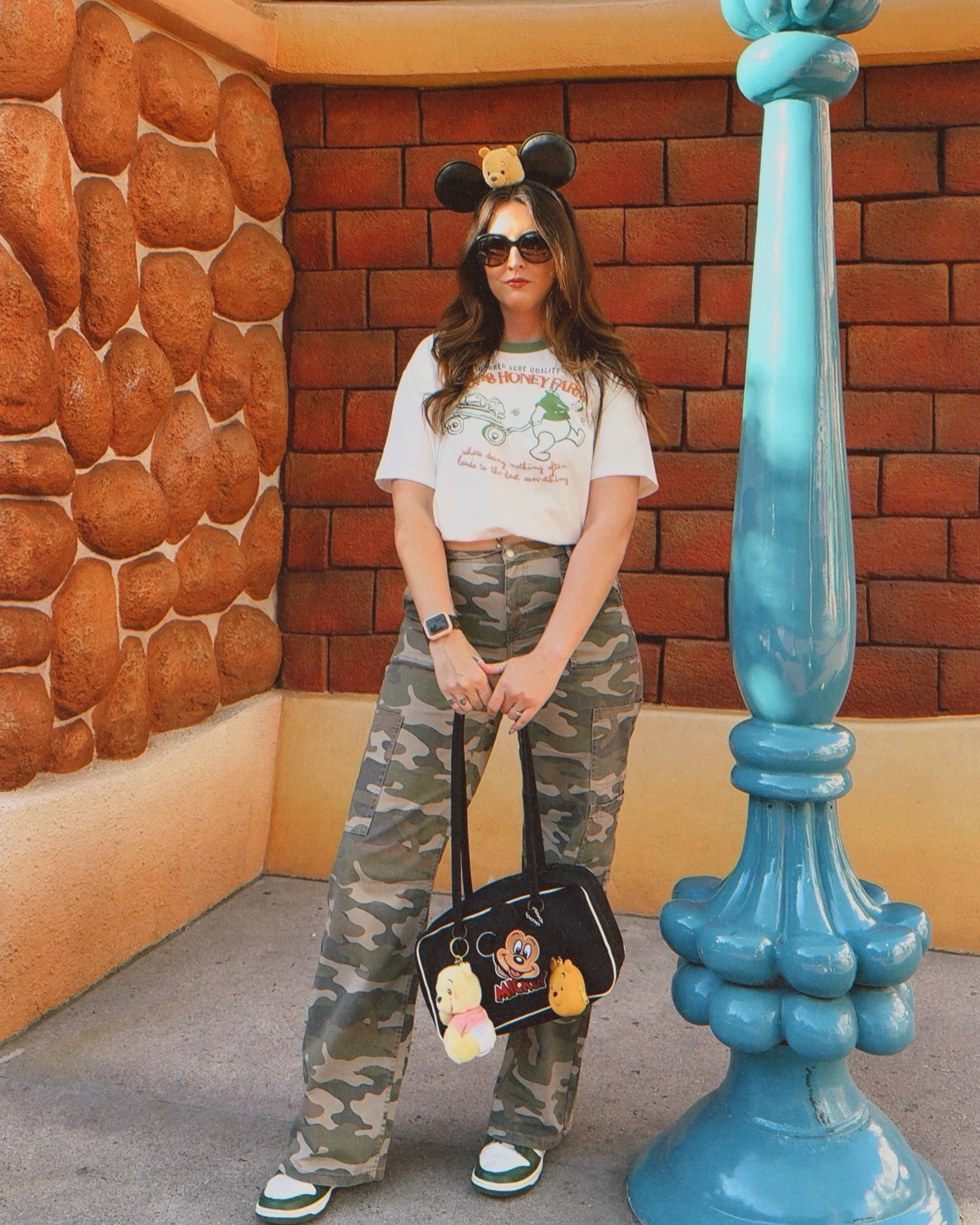 Another fun day at Disney! Even though it was 98°, these pants were comfy and not too hot! They have a long option as well which is what I’m wearing. For reference I am 5’8”. The shirt runs a bit oversized but I love the design on it. The touches of green were perfect for St. Patrick’s Day ☘️ Can you tell this is currently my favorite bag? 🥰🥰 If you love Disney, follow along for outfit ideas🛍️💞

#LTKootd #LTKdayinmylife #LTKmomlife