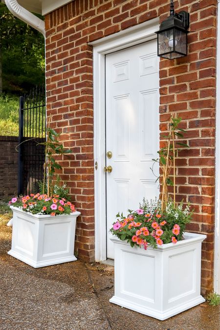 I upgraded my garage door planters this year with these large white ones. They really brighten the entrance !

#LTKHome