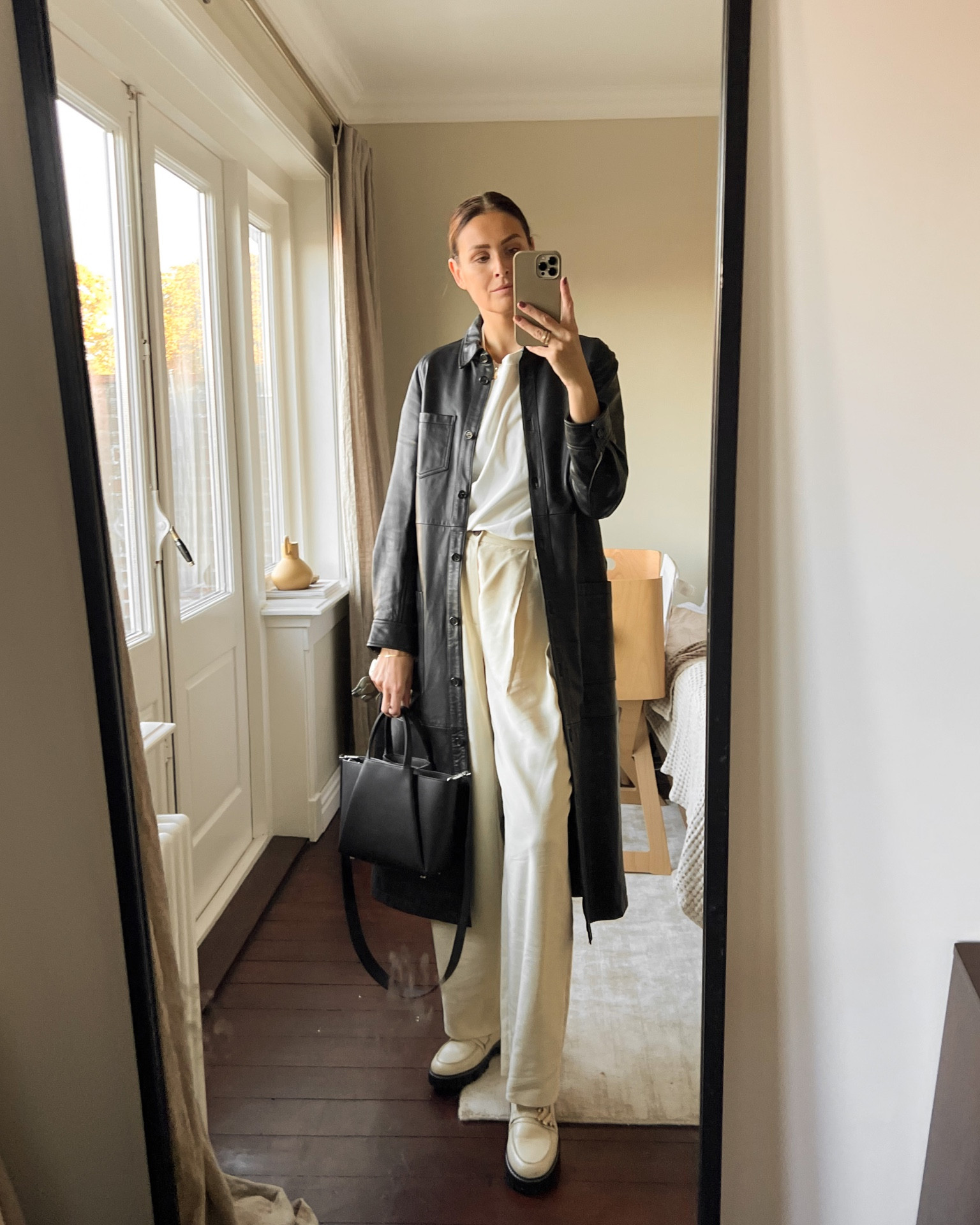 Pleated pants and a black leather coat. #kaaibags #leathercoat #pleatedpants #workwear #loafers

#LTKworkwear #LTKeurope #LTKstyletip