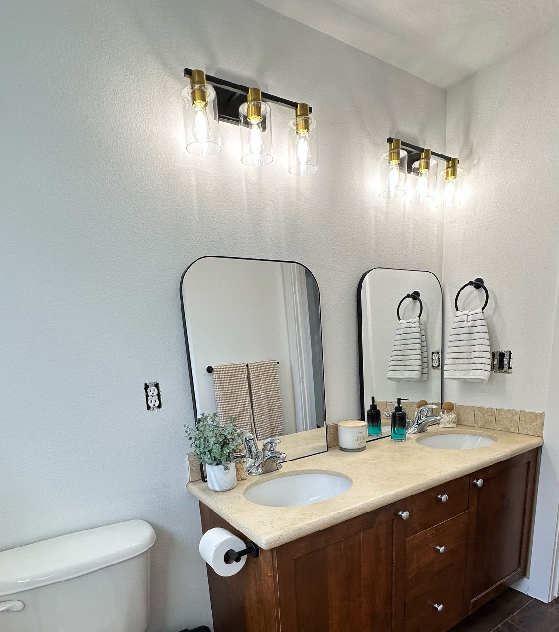 Modern bathroom remodel
Rounded mirrors, modern 3 tier wayfair lighting 


#LTKhome #LTKstyletip
