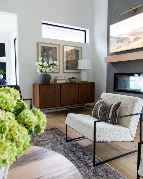 Cozy living room views featuring Castlery sideboard, By Crea boucle armchairs!