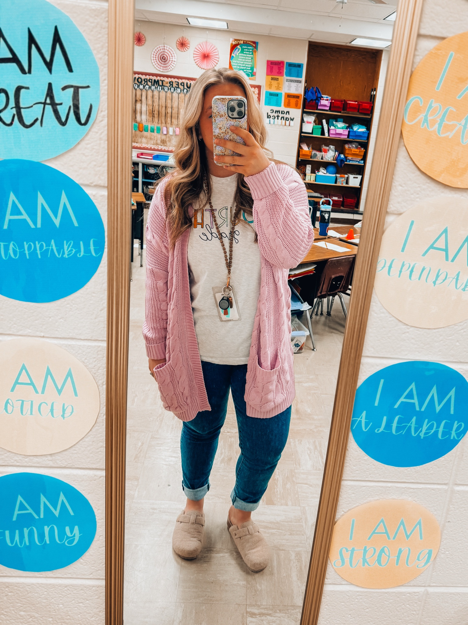 Cute teacher outfit for elementary teachers - orchid lavender spring cardigan - high rise dark wash jeans - buckle slip on clogs - teacher graphic tees 

#LTKMidsize #LTKFindsUnder50 #LTKStyleTip