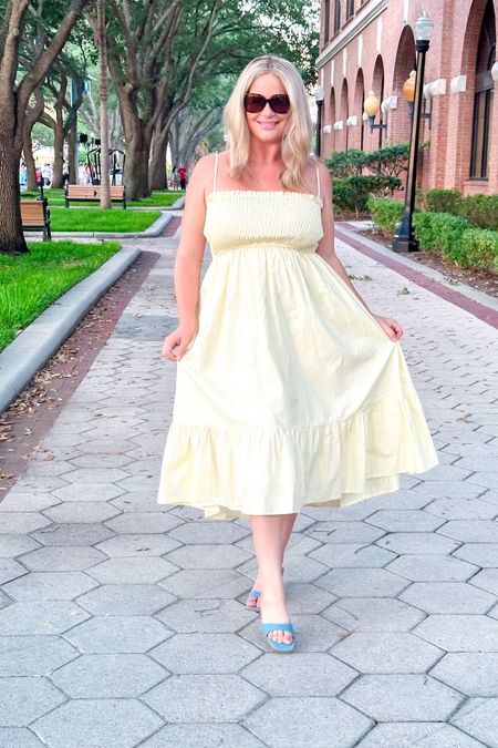 This is the PERFECT dress for summer. I feel like Cinderella. I love the smoke bust and the ruffles at the bottom of the dress. If you are in between sizes, I would recommend sizing down because this dress has a lot of stretch in it. These shoes are denim and they are absolutely beautiful and chic. These shoes are a small heel and easy to walk in. When I am wearing these denim heels I think of Britney Spears 1990s. Use my code Kissthisstyles25 for 25% off sitewide.

Kissthisstyles20 will also work. My code was bumped up for the new fourth of juky launch.

Denim mule
Heels
Mule
Midi dress
Maxi dress
Summer dress
Summer style 
Smocked dress
Stretchy dress
Tall girl style
Vici discount code
Fourth of July dress
Fourth of July outside
Oversized sunglassess
White square sunglasses
Designer dupe sunglasses
Vacation outfit 
Vacation dress
Bumpfrindly dress 

#LTKParties #LTKSeasonal #LTKShoeCrush