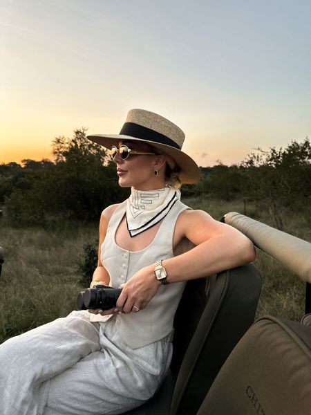 Safari chic wearing waistcoats and linens and accessorised with straw hats, neck scarves and jewellery 🐆