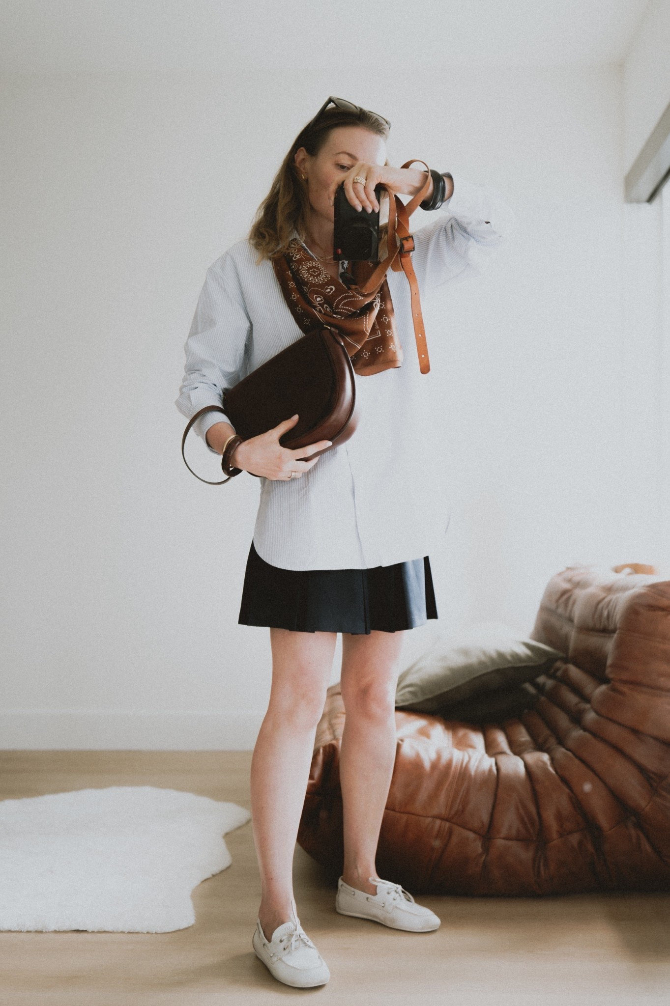 Big shirt, short skirt + taking a page from  Celine Printemps 2026 playbook again: an oversized silk bandana. 

#LTKSeasonal #LTKWorkwear #LTKShoeCrush