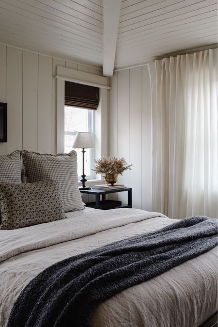 Linen duvet // window pane pillow // budget friendly curtains // candlestick lamp // natural woven Roman shades 

#LTKhome