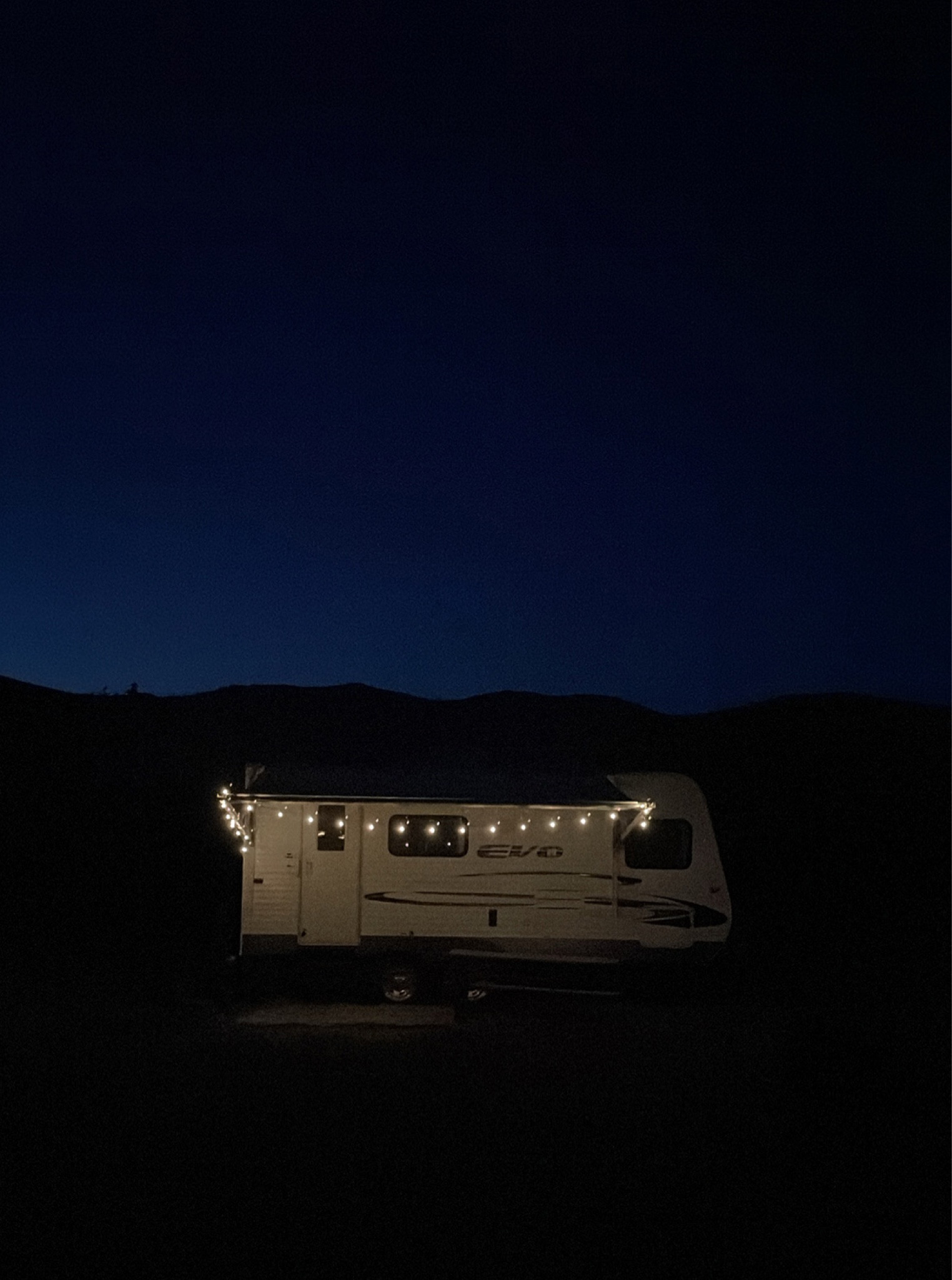 Our camper at night and all of my summer camping essentials  

#LTKhome #LTKFind #LTKSeasonal