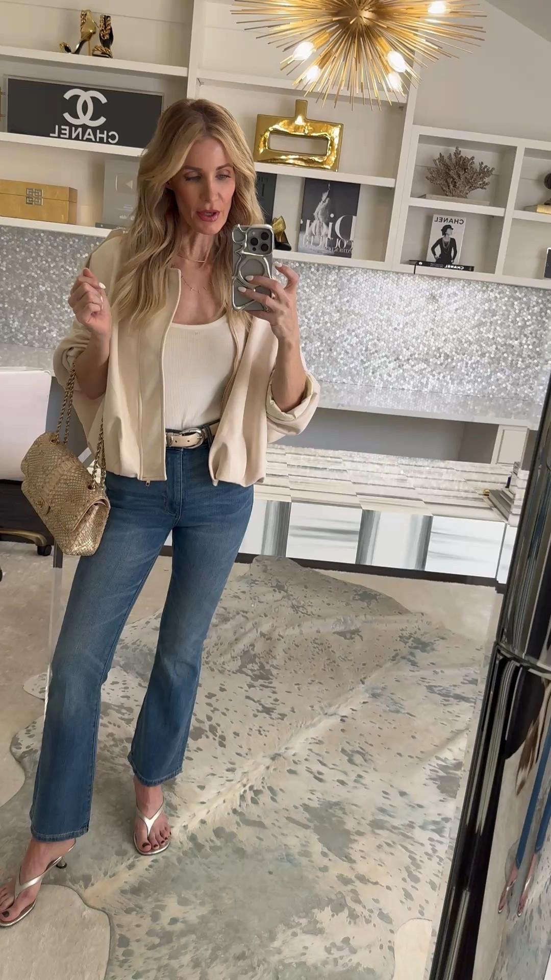 If you’re looking for the perfect lightweight Spring Jacket, this ivory beauty is under $50 and looks so much more expensive. The gold zipper detail and soft bubble hem give it that polished, modern feel, and it layers beautifully over denim for effortless everyday style. I styled it with my go-to DL1961 baby flares in a light-medium wash for an easy, flattering silhouette. I’m wearing an XS in the jacket and 24 in the jeans — fits TTS. 

 #LTKSeasonal #LTKOver40 #LTKSaleAlert