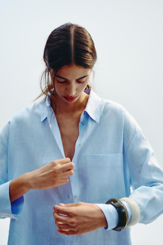 Loose-fitting linen shirt. Featuring a revere collar, long sleeves, a front patch pocket, side ve... | Zara US