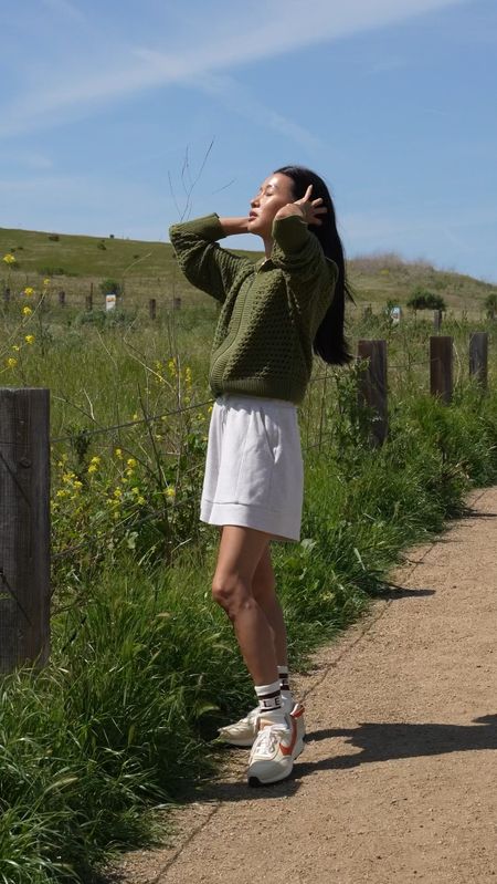 Spring outfit idea: Lightweight knit with high rise shorts and sneakers for a comfortable but chic look.

Wearing xs in the sweater knit and xxs in the shorts. Nike sneakers run tts and are under $80! 

#LTKfindsunder100 #LTKActive #LTKover40