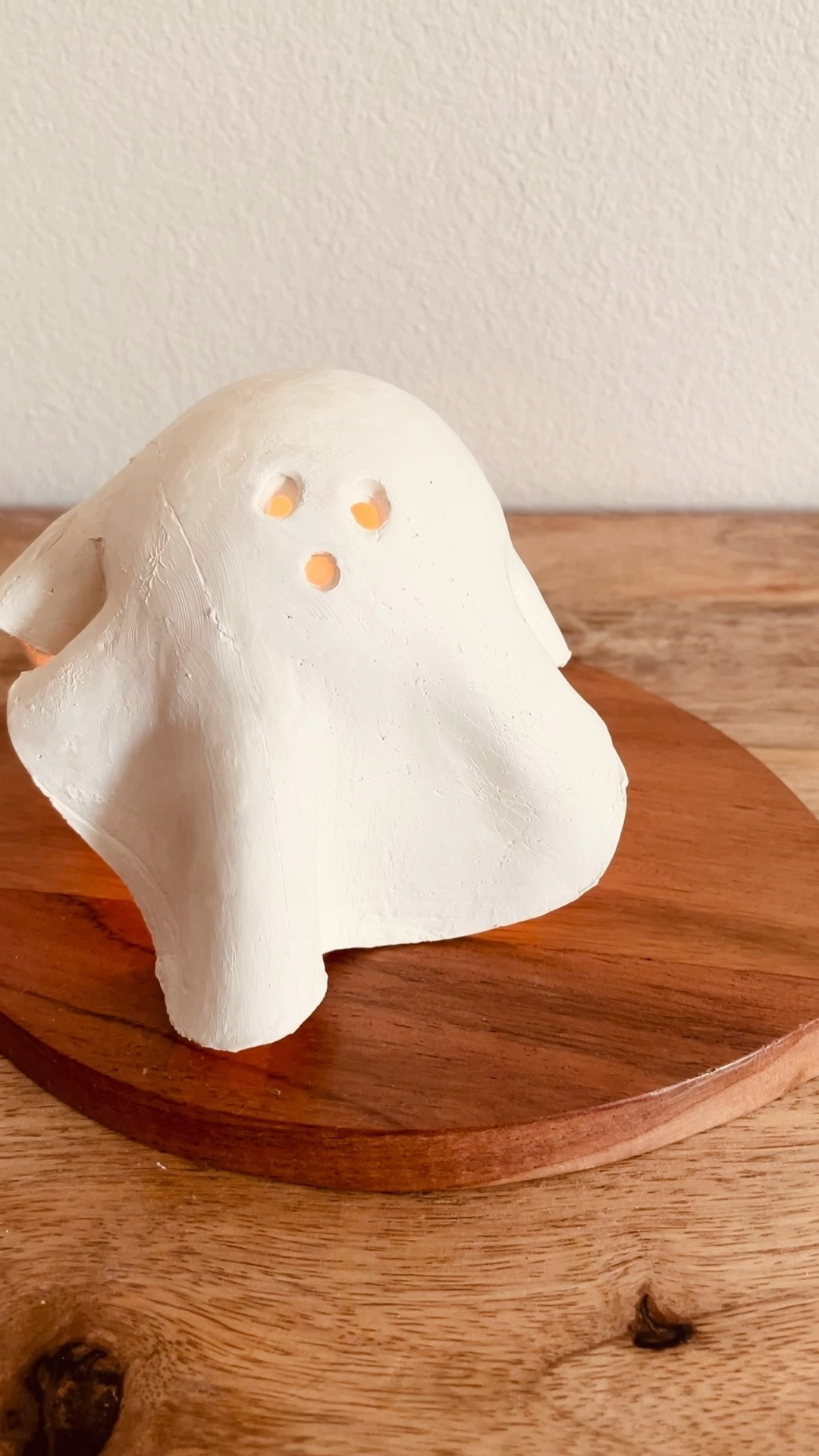 In true autumn spirit, I of course had to bring back this DIY! 👻

Comment “spooky” and I’ll send you the link for all of the supplies to make your own DIY Mini Ghost Lamp!! 

Ready to get in the spooky mood? This simple and easy fall craft uses minimal supplies and doesn’t take much time to make! It looks sleek and modern and brings a cozy, warm glow during spooky season. 

Grab some air dry clay from any craft store, I used Crayola’s air dry clay. 

Roll a large chunk of clay flat (on top of a large piece of Glad Cling Wrap) as if rolling out cookie dough.

Next, tape a small ball to the top of an upside down red Solo Cup. Cover this drying stand with some Glad Cling Wrap to avoid your ghost from sticking while it dries!

Cut the perimeter of your flattened clay into an (imperfect) circular shape.

Then lift the clay circle by the Glad Cling Wrap underneath and gently drape it over your solo cup drying stand. Gently press clay down around cup, creating drape like curves.

Puncture three holes for eyes and a mouth using a straw (use your creative freedom to give the ghost its own personality).

Wait 2-3 days for air dry clay to fully dry. Gently lift ghost off the stand. Leave your ghost with an organic clay finish or customize it with paint.

Find a cute place to display your ghost & place a battery operated tea light candle underneath (opt for a battery operated candle to avoid overheating the clay with a real flame, I linked my favorite ones)!

#halloweendecor #halloweendiy
#diyhalloween #halloweenhomedecor #ghostdiy #halloweendecor #falldecor #moderndecor 

#LTKHome #LTKSeasonal