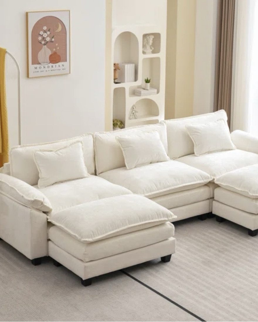 Comfy Cloud couch

Black Friday Deal- this couch comes with two ottomans,
Giving it a U-shaped silhouette & plenty of space for 5 people. 

Dimensions- 120” W X 33.8” D 
See second picture 

#LTKU #LTKHome #LTKCyberWeek