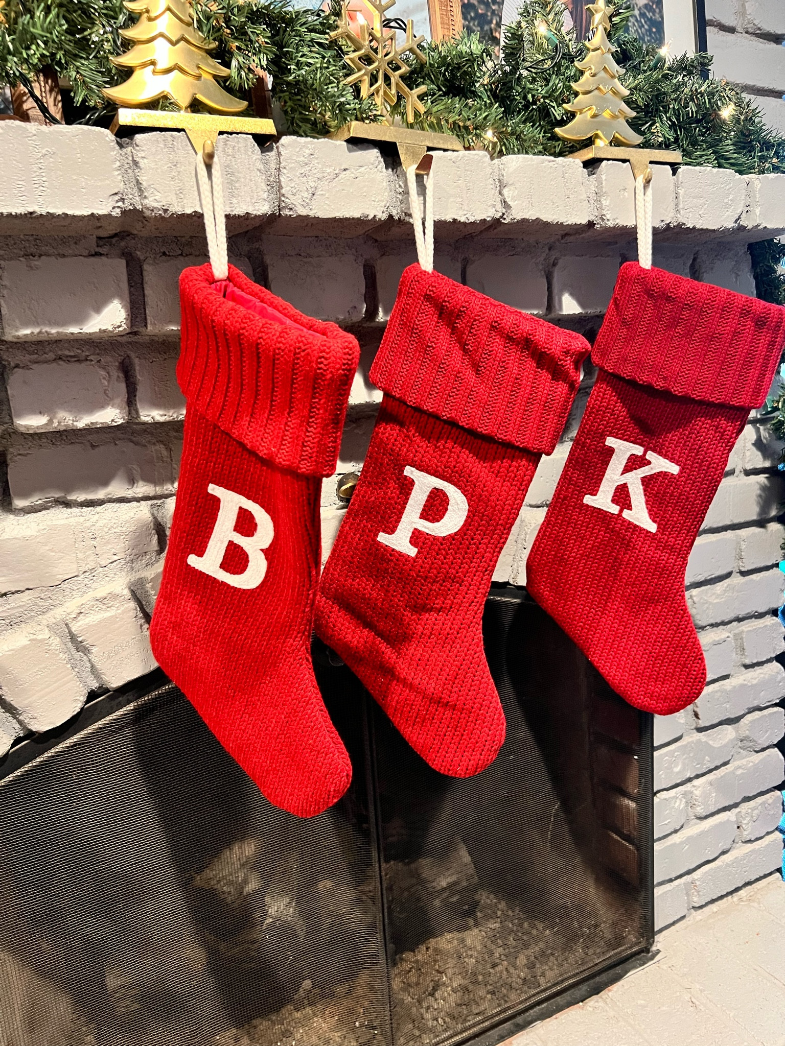 Christmas decor. Christmas stockings. Initial stockings. Stocking holders. Christmas fireplace. Holiday decor. Fireplace decorations. Mantle decorations. Red stockings. Gold and red holiday decor. 

#LTKhome #LTKSeasonal #LTKHoliday
