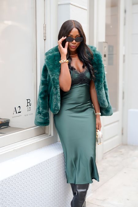 THIS DRESS IS LIVE!!!!! Runnnnnnn! When I wore this in NYC it was absolute perfection. It is the perfect holiday dress. The green is so beautiful. I’m wearing a medium and it fits nicely. Size up for a looser fit. 

#LTKHoliday #LTKstyletip #LTKSeasonal