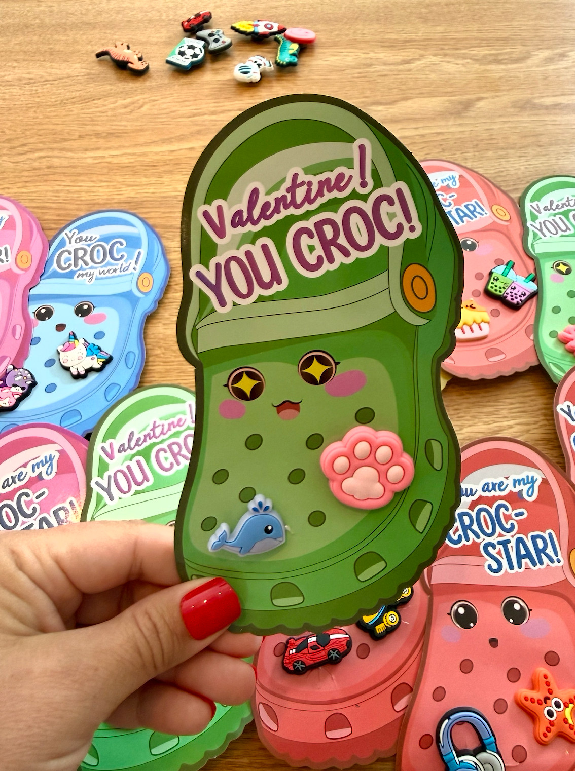 We’re passing these out Thursday — wish me luck because I’m volunteering with 12 three-year-olds 🫠
These are Valentine cards that come with Croc charms you pop right in. Super cute, no candy, and easy enough that my son could help put them together (huge win).

They arrived in time for Valentine’s Day and the kids can actually keep the charms after.
If you’re still figuring out classroom Valentines, these made it simple. 

 #LTKValentine #LTKmomlife #LTKKids