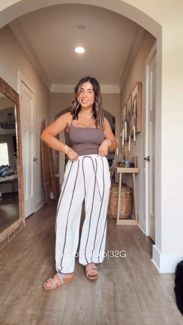 These new linen pants are already my favorite. These are so freaking cute with the slight barrel leg and stripes. This brown tank top smoothes everything out and makes the girls look great. 
Casual spring outfit, petite friendly linen pants 

#LTKMidsize #LTKootd #LTKSeasonal
