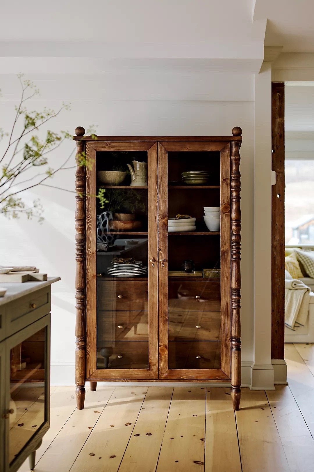 This is the piece that makes your home look like you collected it over time…not ordered it all at once.

The Anthropologie Spindle Hutch is that one piece that makes your entire home feel curated.

Crafted from warm-toned wood with glass doors, spindle detailing, and classic hardware, it blends vintage charm with modern rustic design — giving your space that layered, lived-in look.

With adjustable shelving and drawer storage, it’s perfect for styling dishes, decor, books, or everyday essentials while still feeling elevated.

Ideal for kitchen storage, dining room styling, or cozy living spaces, this cabinet brings warmth, texture, and timeless character into any home.

#LTKHome