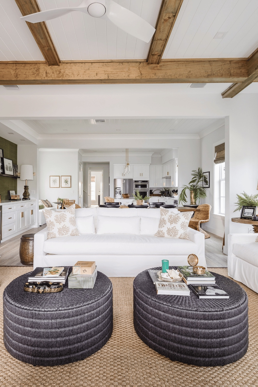 A beach house living room that you can really live in!  Washable slipcovered sofa, outdoor coffee tables (super durable) and heavy duty natural fiber rug.

What's the first thing you'd do when you check in?

#florida #homedecor #potterybarn #fourhands  

 #LTKHome