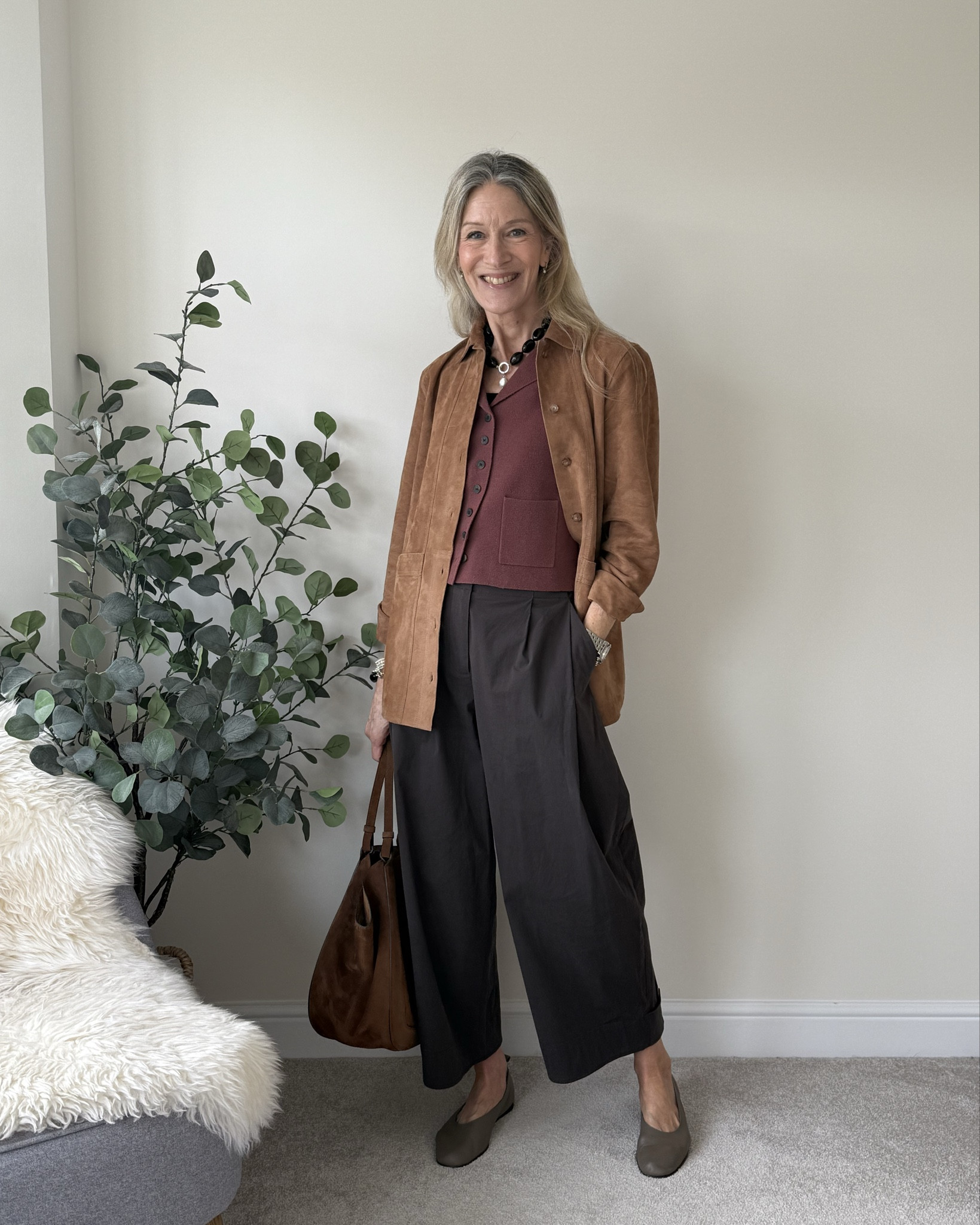 Earthy tones still work for Spring. 
A Suede jacket works as a lighter layer over sleeveless tops. 
Tan Suede Jacket
Chocolate Brown Barrel Trousers
Waistcoat Vest
Ballet Flats 

#LTKstyletip #LTKover50style #LTKspring