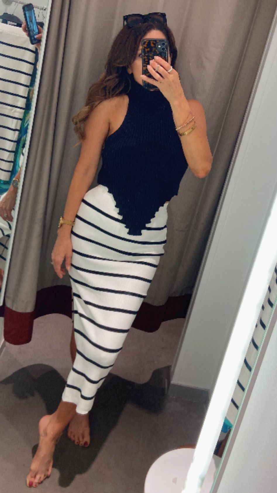 Striped midi skirt knit maxi skirt black turtleneck knit tank top date night H&M under $20

#LTKsalealert #LTKFind #LTKstyletip
