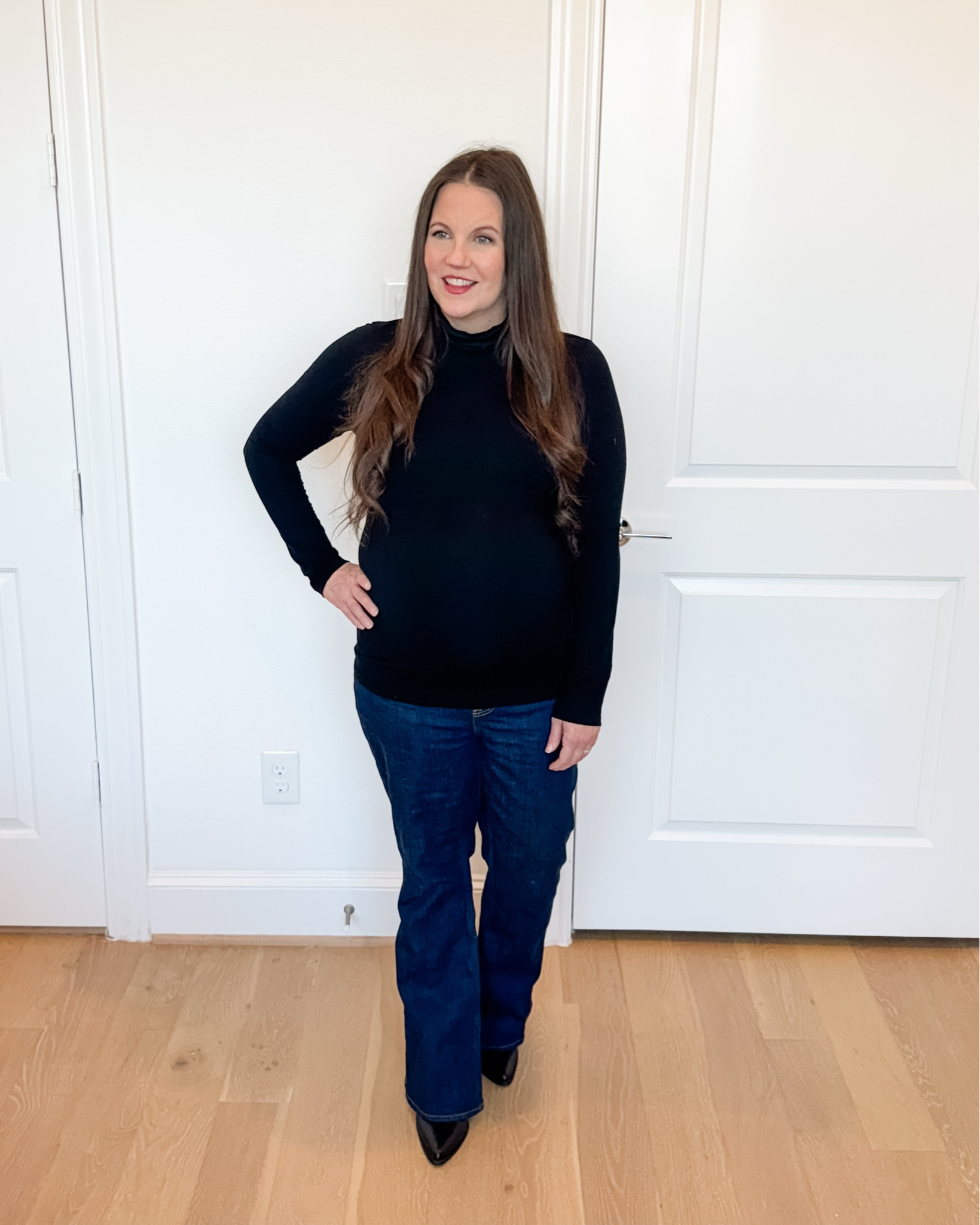 Dressy Casual

This dressy-casual maternity outfit is perfect when you want something comfortable but still elevated. The black long sleeve turtleneck styled with dark blue flared jeans makes such a classic pairing, especially when wearing the best maternity jeans for support and stretch.

Adding black booties gives the outfit a finished look that’s easy to wear throughout pregnancy.


#LTKWorkwear #LTKBump #LTKPetite