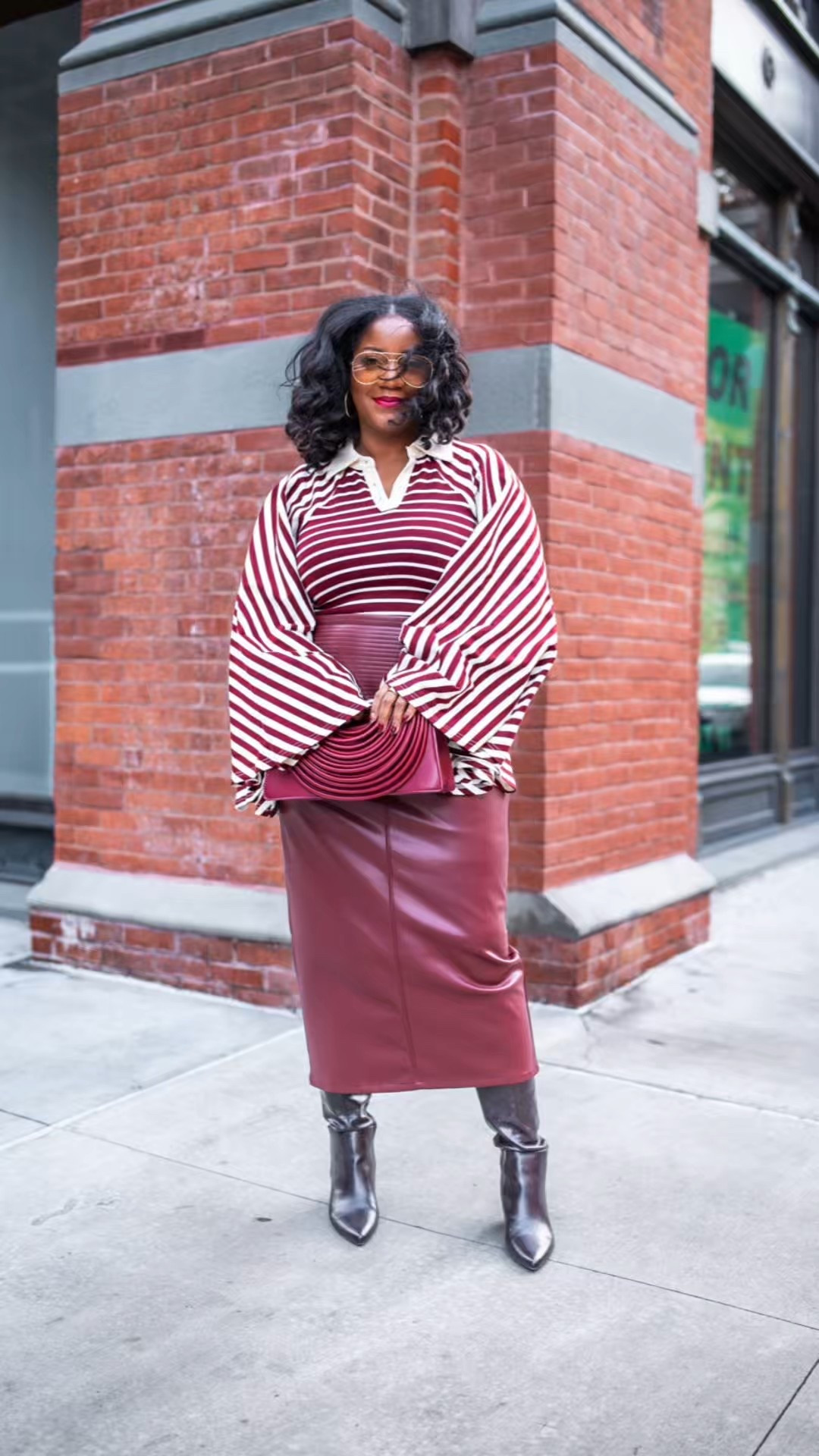 Sleeves and The City, Episode 6: The Bigger the Sleeves, the Closer to God. Bold stripes and dramatic sleeves paired with a sleek faux leather midi. Top is from Akira, skirt and wide calf friendly boots are both Amazon finds. Wearing a L in the top and skirt. 

striped long sleeve top / statement sleeves outfit / maroon faux leather skirt / midi leather skirt outfit / wide calf friendly boots / lifestride boots / fall outfit ideas / chic fall outfit / amazon fashion finds / sleeve friendly outfit / modest fashion outfit / long sleeve outfit ideas / burgundy outfit ideas / street style outfit / queen of sleeves style

#LTKootd #LTKSeasonal #LTKMidsize