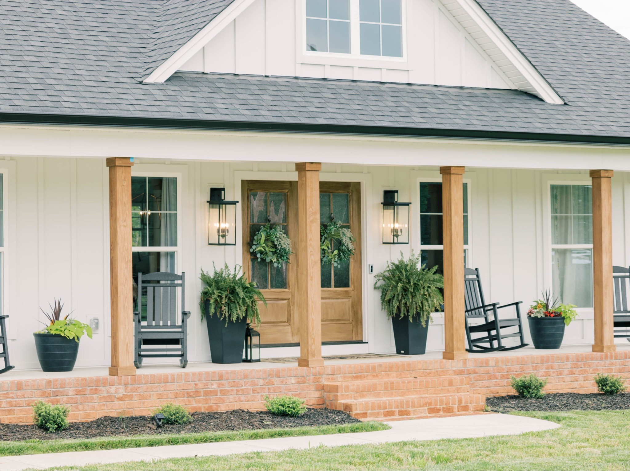 Front porch decor 

White farmhouse, porch decor, black planters, spring decor, front porch rockers, farmhouse porch 

#LTKHome #LTKStyleTip #LTKFindsUnder100