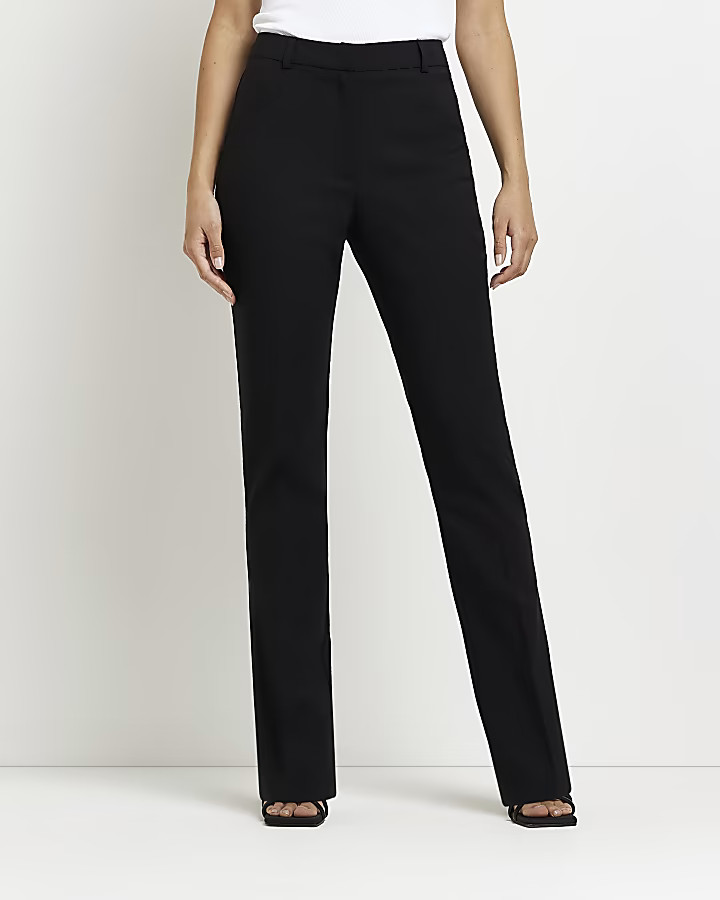 Black mid rise flared trousers | River Island (UK & IE)