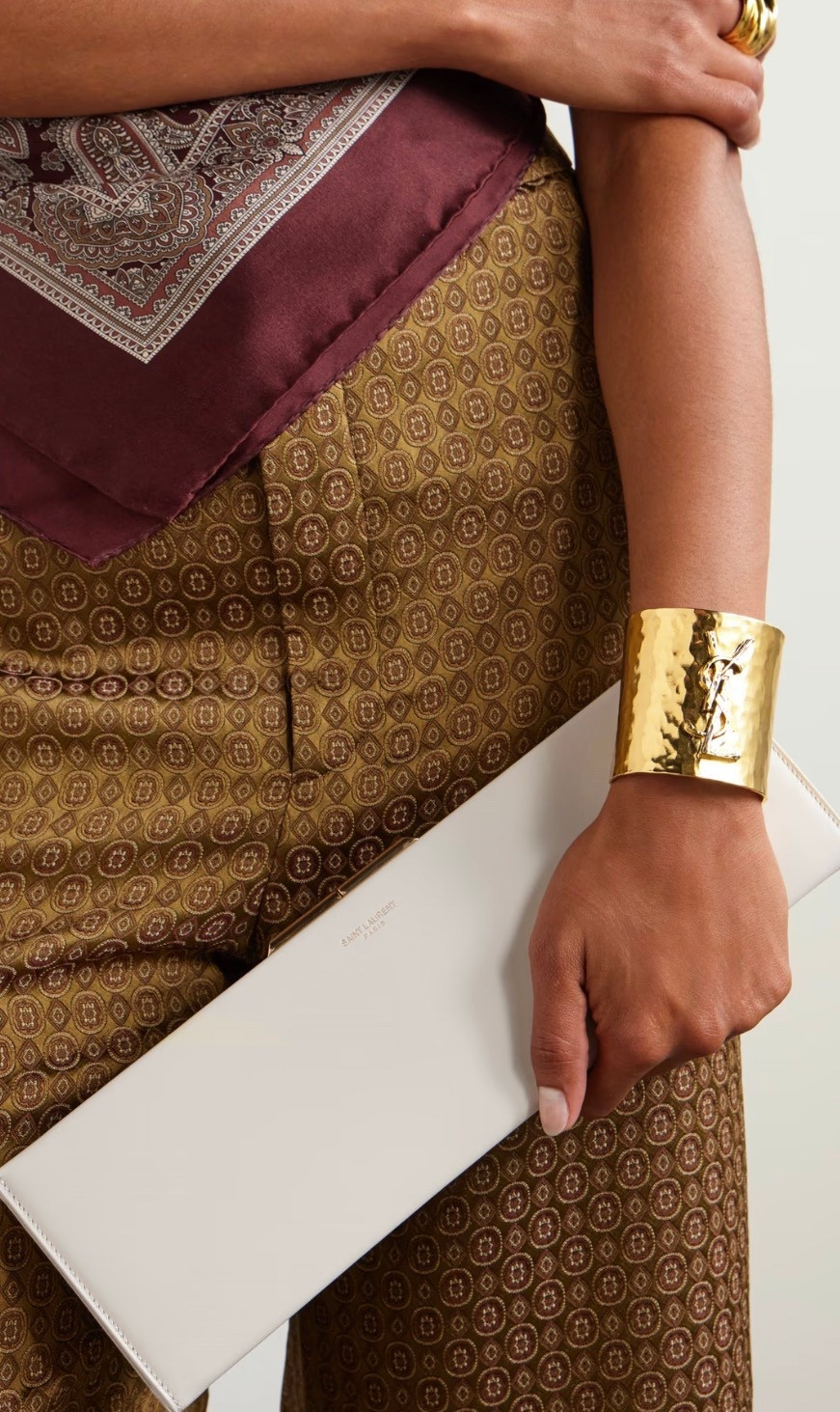 SAINT LAURENT Midnight leather clutch is the perfect companion for glamourous evenings out. It’s made from leather in a sleek rectangular shape and stamped with a foiled logo to match the gold-tone hardware. Slip your phone, cards and a lip gloss inside.

White leather (Calf)
Internal card sleeve
Unlined
Clasp fastening at top

This item’s measurements are:
Product measurements:
Depth: 3.5cm / 1.4in
Height: 10.5cm / 4.1in
Width: 33cm / 13in




#LTKValentine #LTKootd