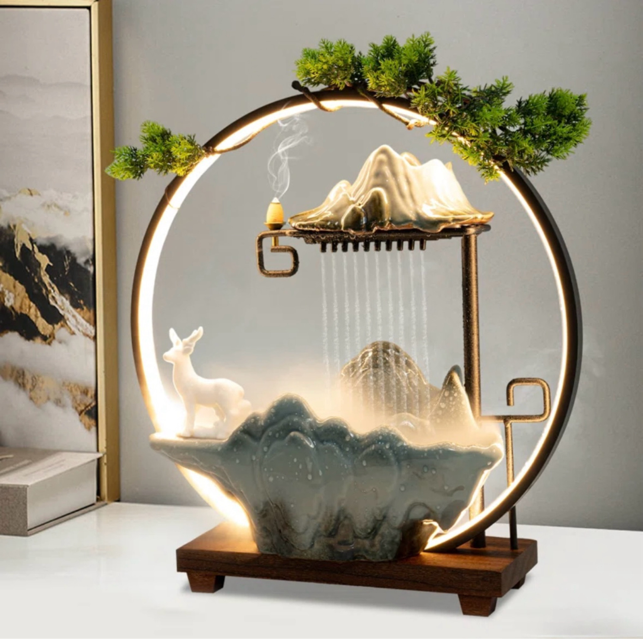 Glowing circle, pine tree, deer, and rocks, flowing water feature. The lively design makes the tabletop fountain a beautiful landscape for a home/ office.

#LTKxPrimeDay #LTKHome #LTKSeasonal