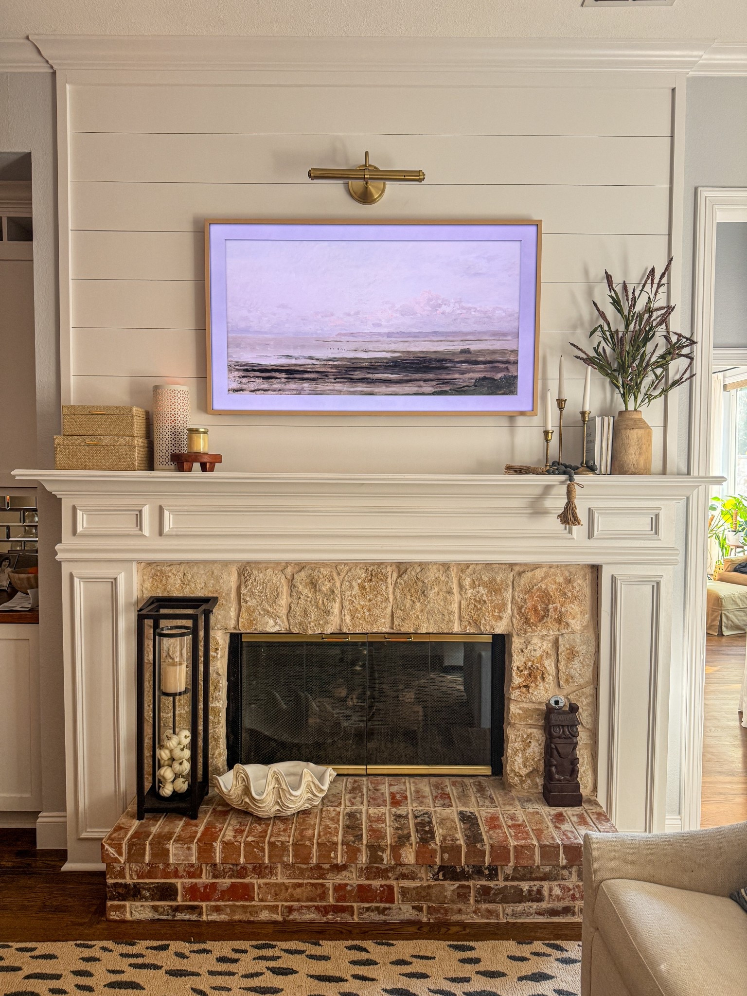 Added an art lamp to the fireplace over our Frame TV. Love this look! 



#LTKHome